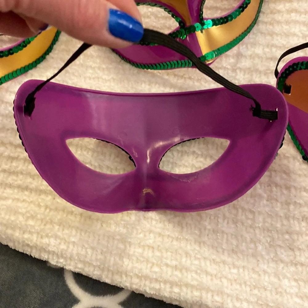 Set of 7 Mardi Gras Masks! Hard plastic purple masks. Very hearty and will last!